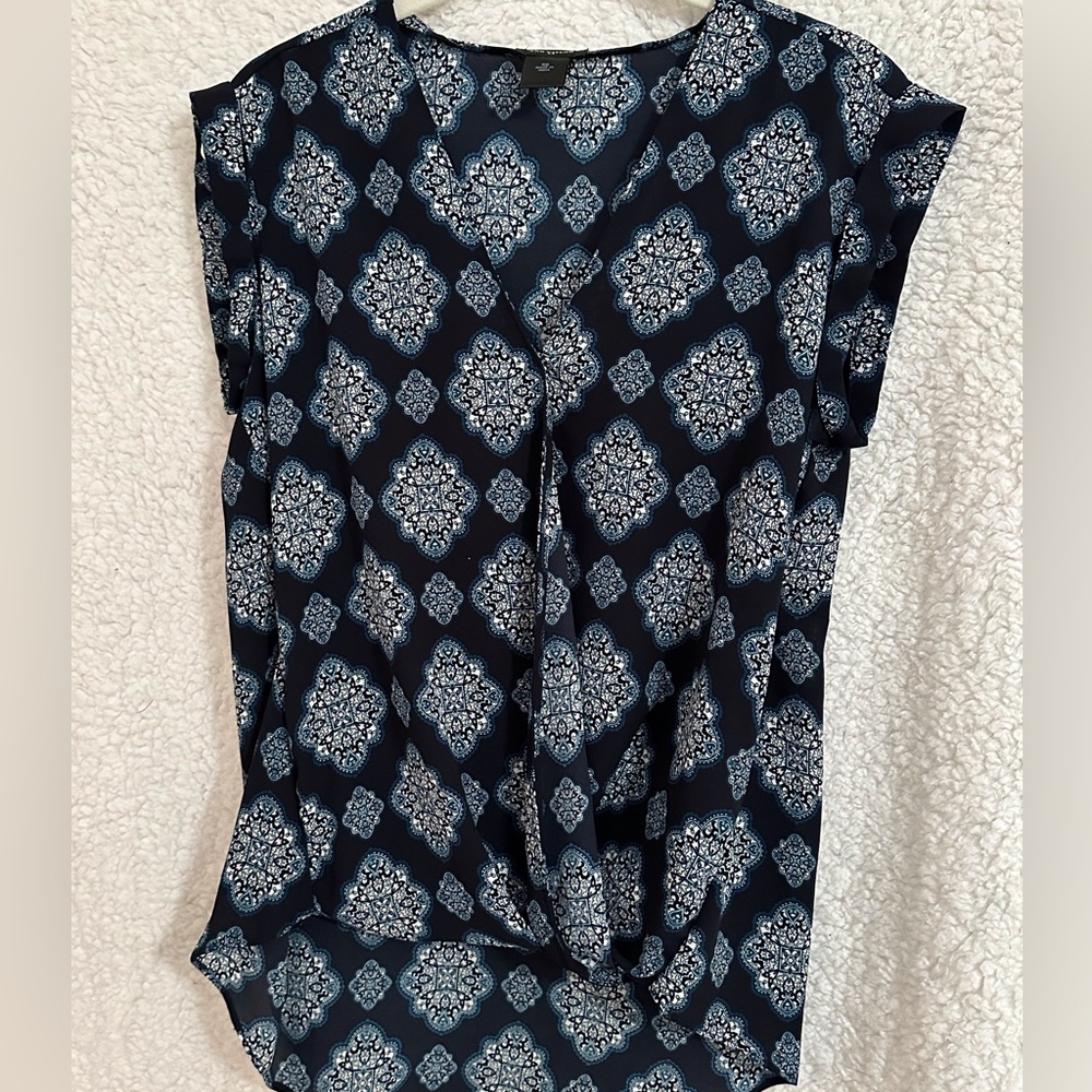 Ann Taylor hi-low, false wrap, gathered front bottom.